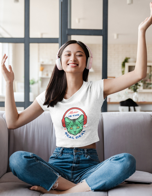 Make a fashion statement with our Women's Music Meow Crop Top. With its captivating cat wearing headphones illustration and the phrase 'Music Is the Real Deal,' this shirt lets you showcase your love for music and feline friends. Explore Womanitee's collection of women's t-shirts online in India and embrace your unique style.